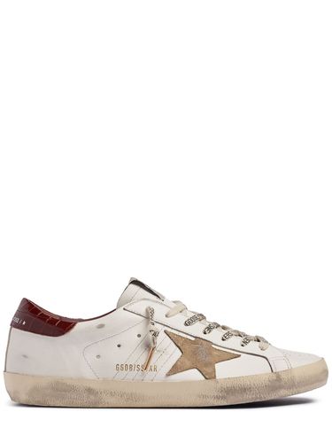 Sneakers En Cuir Et Daim Super Star - GOLDEN GOOSE - Modalova