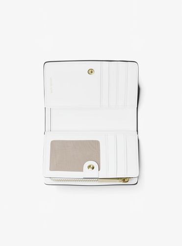 MK Portefeuille Bryant de taille moyenne en cuir grainé - Michael Kors - MICHAEL Michael Kors - Modalova