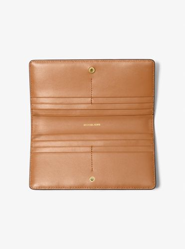 MK Grand portefeuille Bryant avec logo Signature et bouton-pression sur le devant - Michael Kors - MICHAEL Michael Kors - Modalova