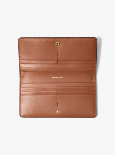 MK Grand portefeuille Bryant en cuir grainé avec bouton-pression sur le devant - Michael Kors - MICHAEL Michael Kors - Modalova