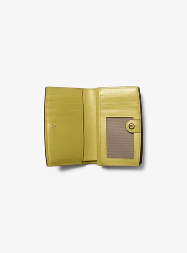 MK Portefeuille Bryant de taille moyenne en cuir grainé - Michael Kors - MICHAEL Michael Kors - Modalova