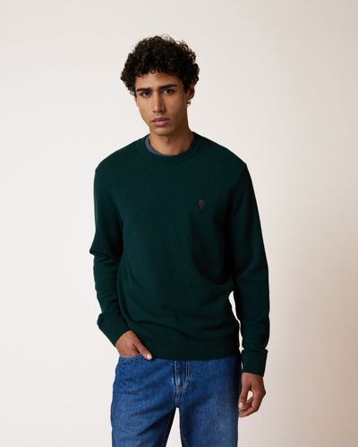 Pull col rond en laine vert foncé - FAGUO - Modalova