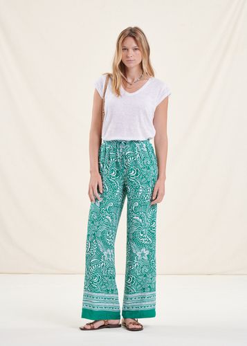 Pantalon fluide vert taille élastique à fleurs - La Fée Maraboutée - Modalova