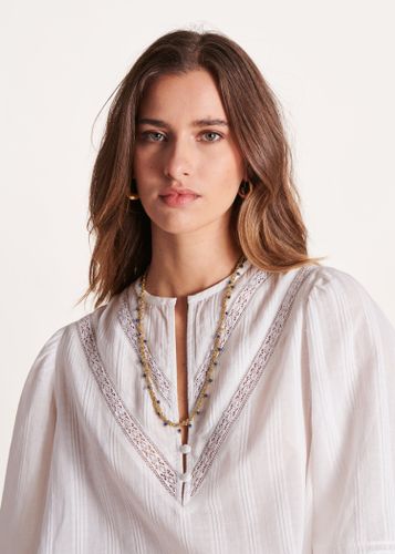 Collier métal doré enroulé et petites bleues - La Fée Maraboutée - Modalova