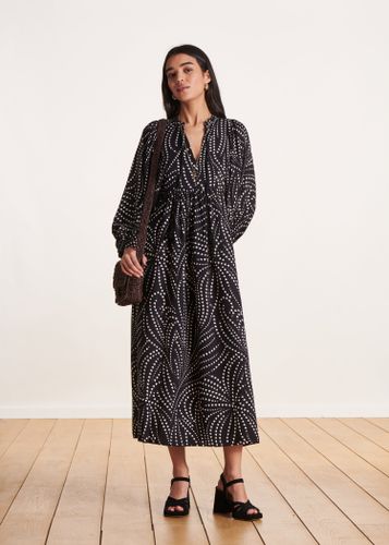 Robe longue fluide noire à imprimé floral et manches longues - La Fée Maraboutée - Modalova