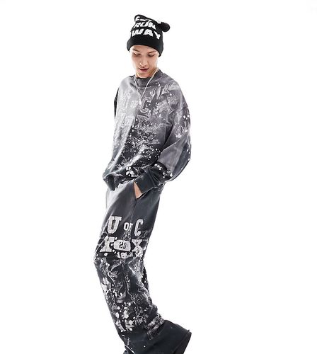 Varsity - Pantalon d'ensemble de jogging avec imprimé taches de peinture - Gris - Collusion - Modalova