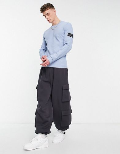 Top manches longues ajusté en tissu gaufré avec écusson à monogramme - clair - Calvin Klein Jeans - Modalova