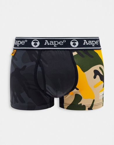 Aape By A Bathing Ape - Boxer à imprimé camouflage effet coupé-cousu avec taille à logo - Noir et jaune - Aape By A Bathing Ape® - Modalova