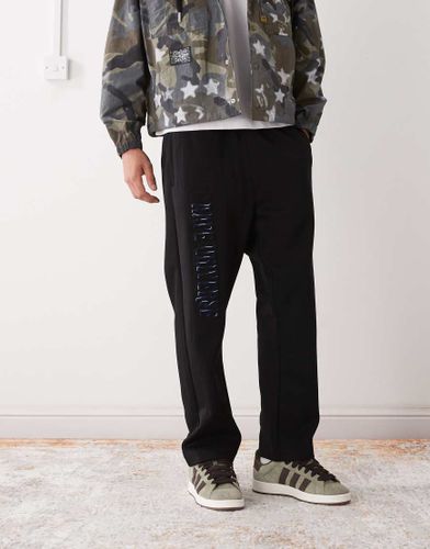 AAPE by A BATHING APE - Pantalon de jogging ample avec broderie sur la jambe - Aape By A Bathing Ape - Modalova
