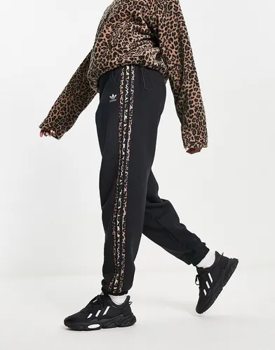 Pantalon de jogging à trois bandes à imprimé léopard - Adidas Originals - Modalova