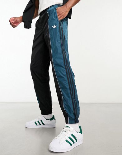 Rekive - Pantalon de survêtement à empiècements en tulle - et bleu - Adidas Originals - Modalova