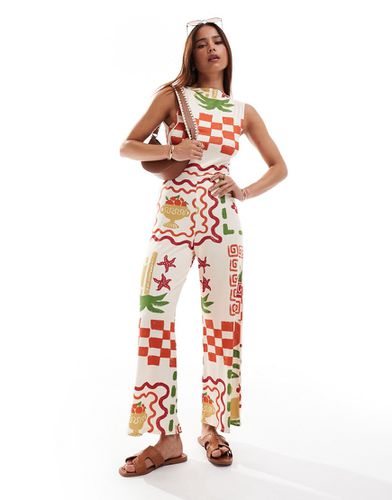 Combinaison jupe-culotte à imprimé carte postale avec encolure bateau et dos ouvert à détails noués - Asos Design - Modalova