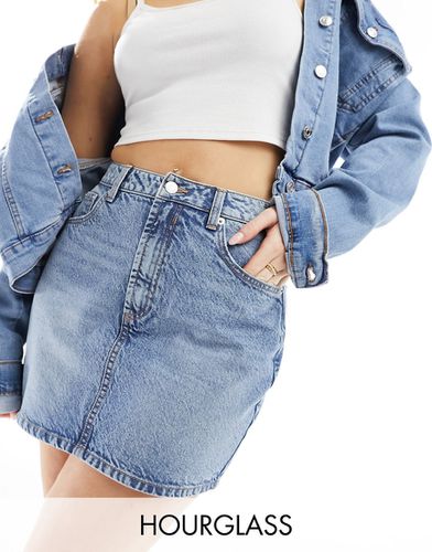 Hourglass - Mini-jupe en jean à taille haute - délavé moyen - Asos Design - Modalova