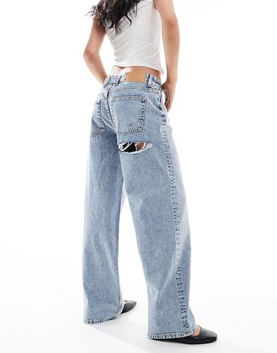 Jean boyfriend baggy à taille mi-haute et déchirures - moyen - Asos Design - Modalova