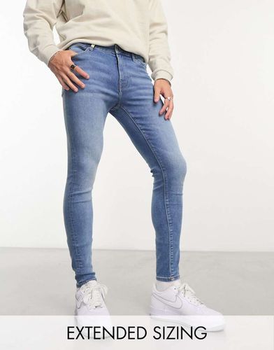 Jean en tissu power stretch - moyen délavé - Asos Design - Modalova