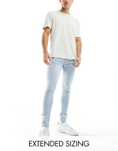 Jean seconde peau en tissu power stretch - délavé clair - Asos Design - Modalova