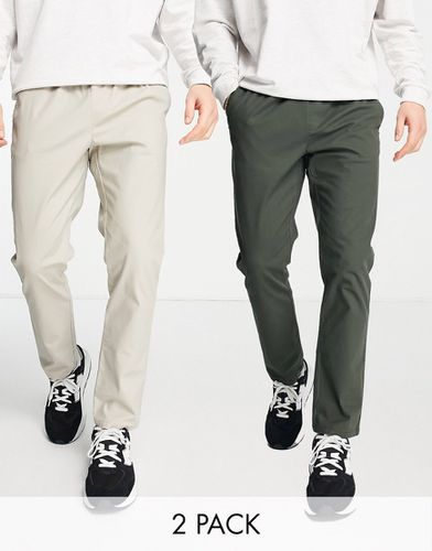 Lot de 2 pantalons chino slim à taille élastique - Vert foncé et beige - ÉCONOMIE - Asos Design - Modalova