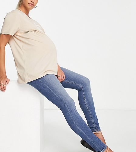 ASOS DESIGN Maternity - Ultimate - Jean ultra skinny avec bande passant sous le ventre - moyen authentique - Asos Maternity - Modalova