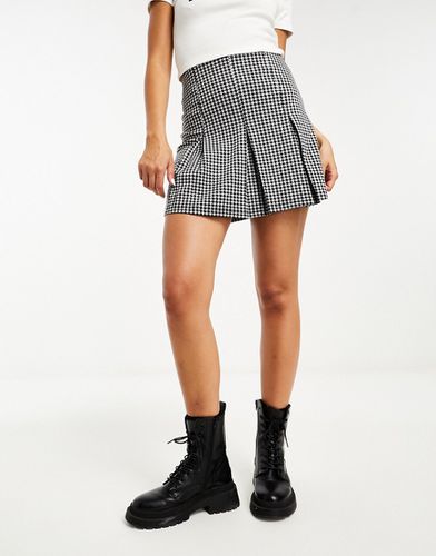 Mini-jupe plissée à motif pied-de-poule - Asos Design - Modalova