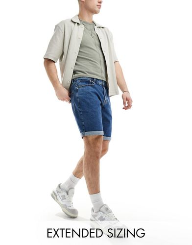 Short en jean coupe slim classique stretch - moyen délavé - Asos Design - Modalova