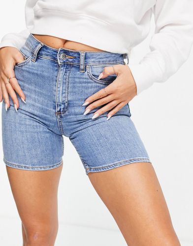 Short skinny taille haute en jean stretch - Délavage moyen - Asos Design - Modalova