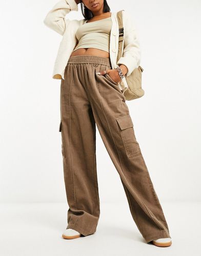 ASOS DESIGN - Pantalon large à enfiler en velours côtelé avec poches  plaquées - Taupe
