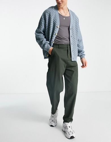 Pantalon chino oversize coupe fuselée - foncé - Asos Design - Modalova