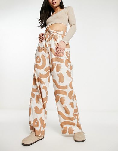 Pantalon à enfiler avec imprimé abstrait - Marron - Asos Design - Modalova
