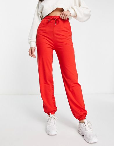 Pantalon de jogging basique coupe slim - Rouge - Asos Design - Modalova