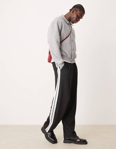 Pantalon de jogging chic ultra baggy avec bande - Asos Design - Modalova