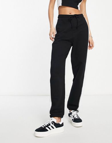 Pantalon de jogging d'ensemble à effet color block - Noir et blanc - Asos Design - Modalova