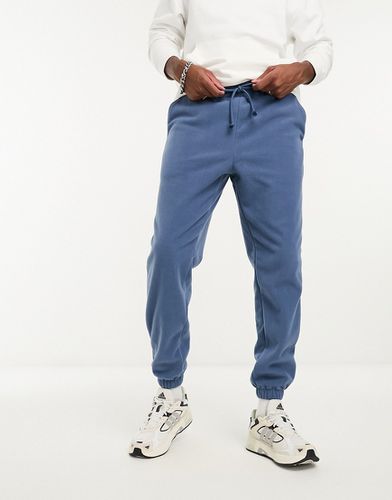 Pantalon de jogging fuselé en polaire - Asos Design - Modalova