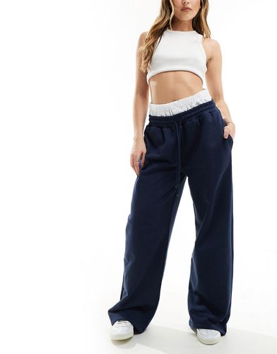 Pantalon de jogging oversize avec ceinture style caleçon - Bleu marine - Asos Design - Modalova