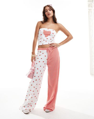 Pantalon d'ensemble ample à imprimé fraises - Asos Design - Modalova