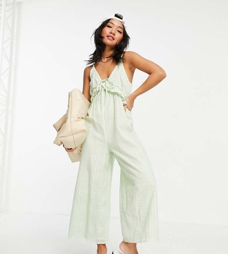 ASOS DESIGN Petite - Combinaison jupe-culotte à volants, lien à nouer et col V - auf de canard - ASOS Petite - Modalova