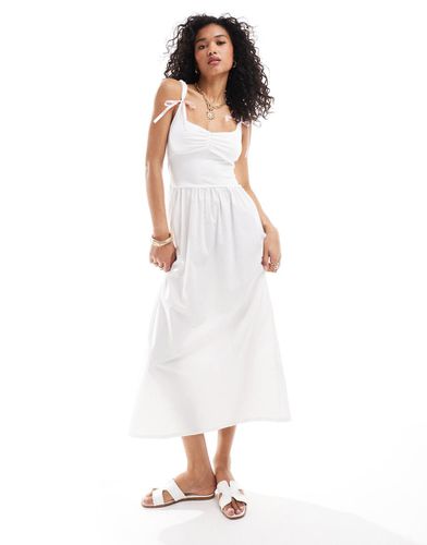 Robe mi-longue tendance folk avec nauds sur les bretelles - Asos Design - Modalova