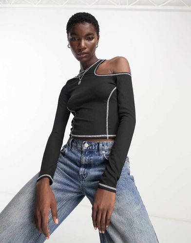 Top asymétrique à manches longues et surpiqûres contrastantes - Noir - Bershka - Modalova