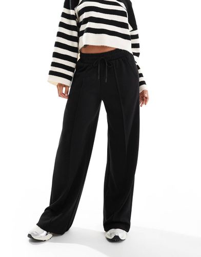 Pantalon de jogging ample noué à la taille - Noir - Bershka - Modalova