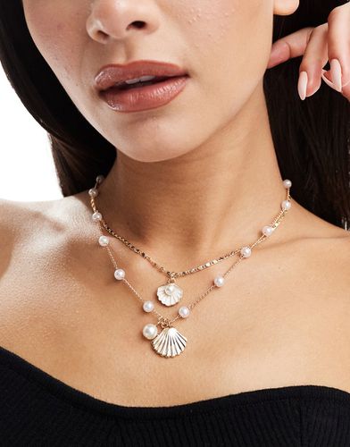 Lot de 2 colliers à breloques perles et coquillages - Designb London - Modalova