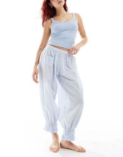 Pyjama avec débardeur en maille pointelle et pantalon long bouffant rayé - clair - Free People - Modalova