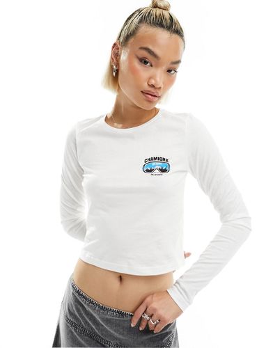 T-shirt crop top avec manches longues et imprimé Chamonix - Noisy May - Modalova