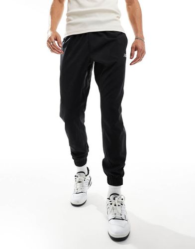 Sport Essentials - Pantalon de jogging tissé - New Balance - Modalova