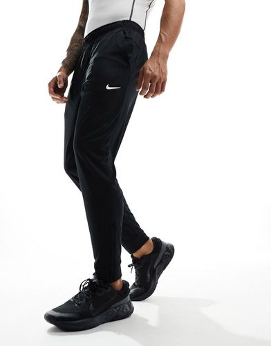 Totality - Pantalon de jogging en tissu Dri-FIT - Nike Training - Modalova