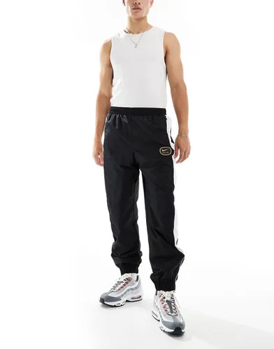 Air - Pantalon de jogging à logo virgule - Noir/ - Nike - Modalova