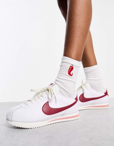 Nike blanche virgule rouge best sale