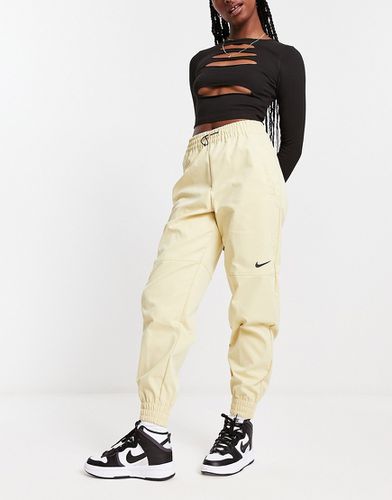 Pantalon cargo tissé à logo virgule - Beige - Nike - Modalova
