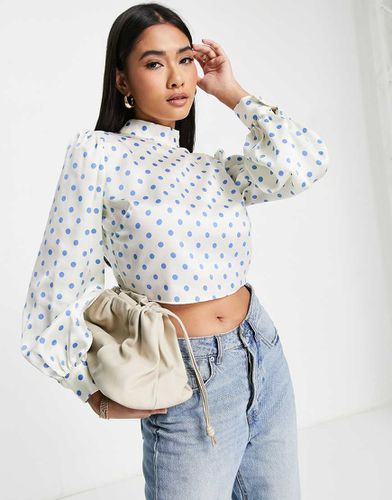 Blouse à pois avec col montant et détail noué dans le dos - River Island - Modalova