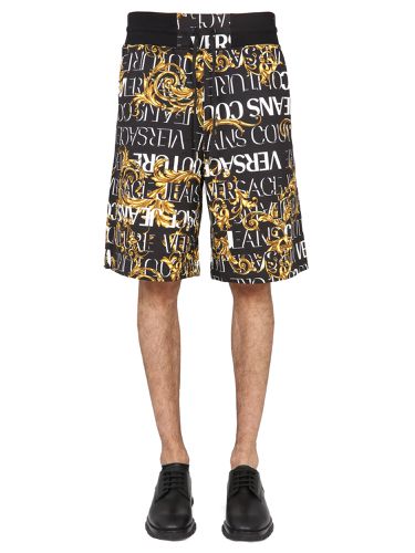 Bermuda shorts with garland print - versace jeans couture - Modalova