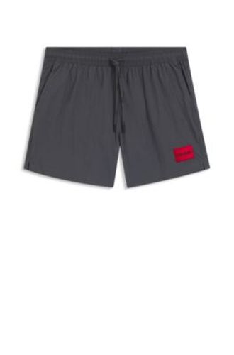 Short de bain à séchage rapide avec étiquette logo rouge - HUGO - Modalova