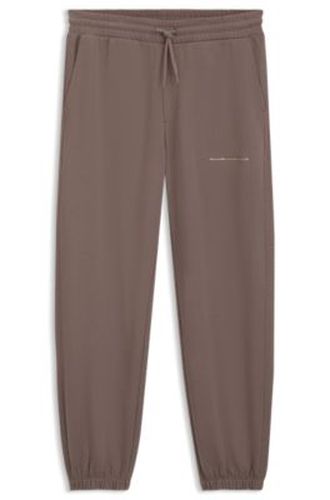 Pantalon Relaxed en coton à logo urbain - HUGO - Modalova